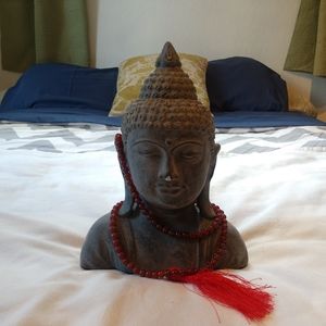 Buddha head with beads